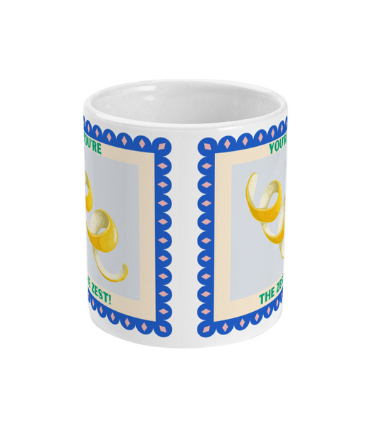 Side view of 11oz coffee mug with lemon peel design with 'You're the Zest!'