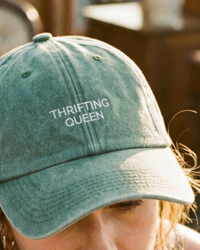 close up of thrifting queen embroidered green denim cap