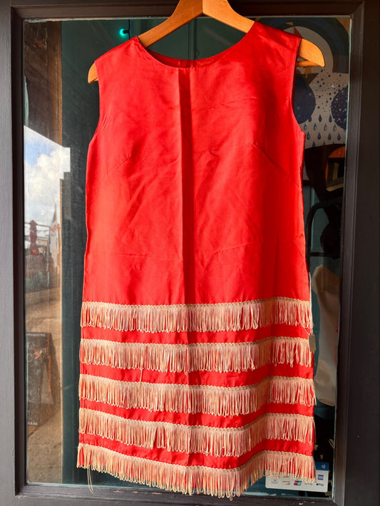 front view of vintage stagewear red dress with cream fringing