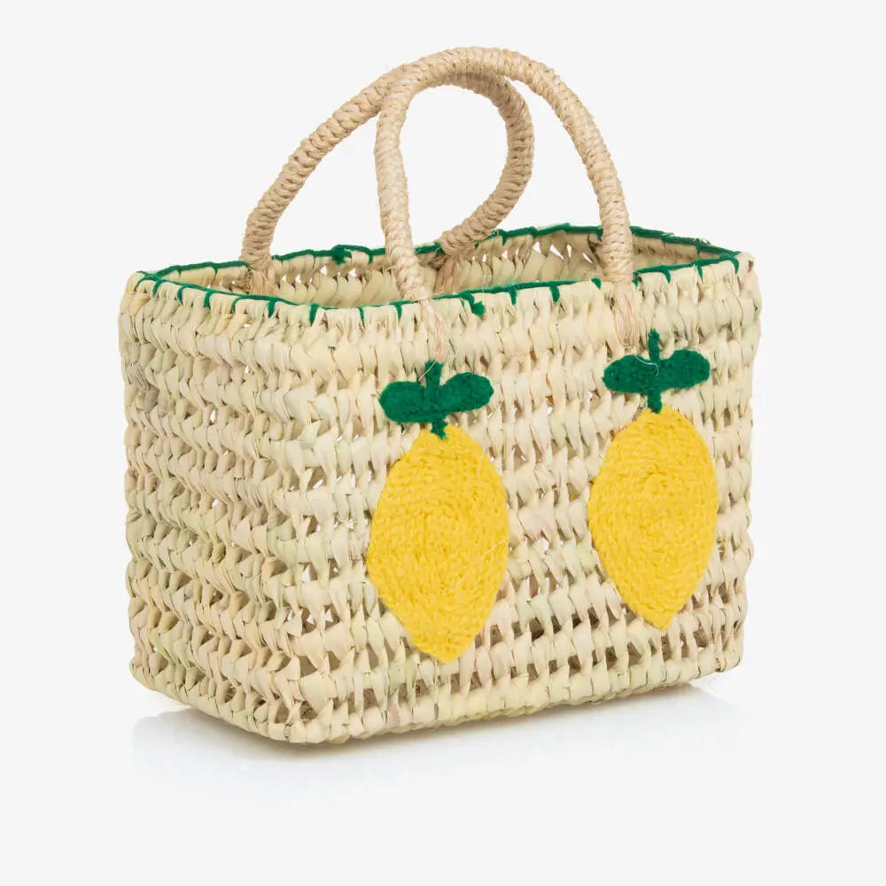 Woven bag with lemon decorations on a white background