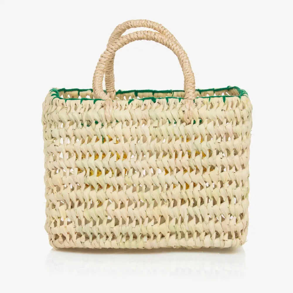 back view of straw bag with handles. No embroidery detail on this side.