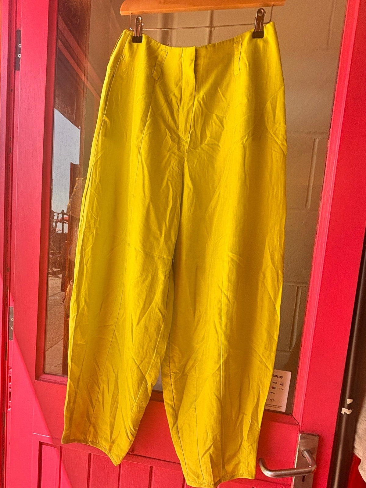 Front view hanging of Emporio Armani Lime Green Cocoon Silk Trousers